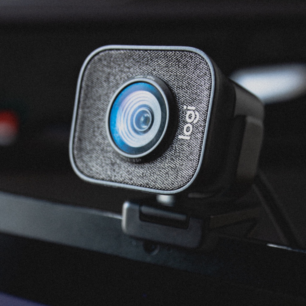 Close-up of a webcam mounted for creator recording